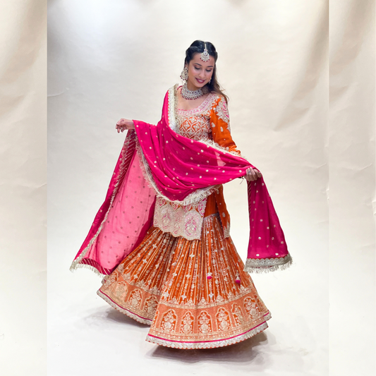 Orange colored sharara set with heavy handwork in georgette