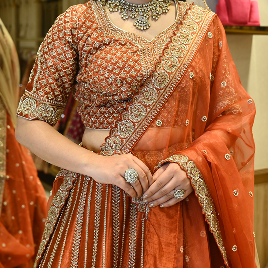 Rust Bridal Raw Silk Embellished Lehenga Set with Two Dupattas