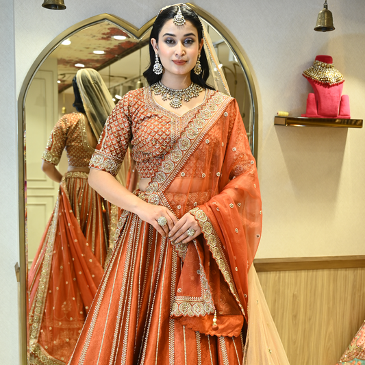 Rust Bridal Raw Silk Embellished Lehenga Set with Two Dupattas