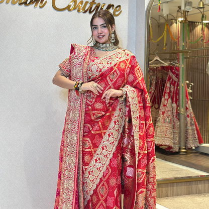 Red Bridal Saree with Intricate Gold Zari Embroidery and Traditional Border
